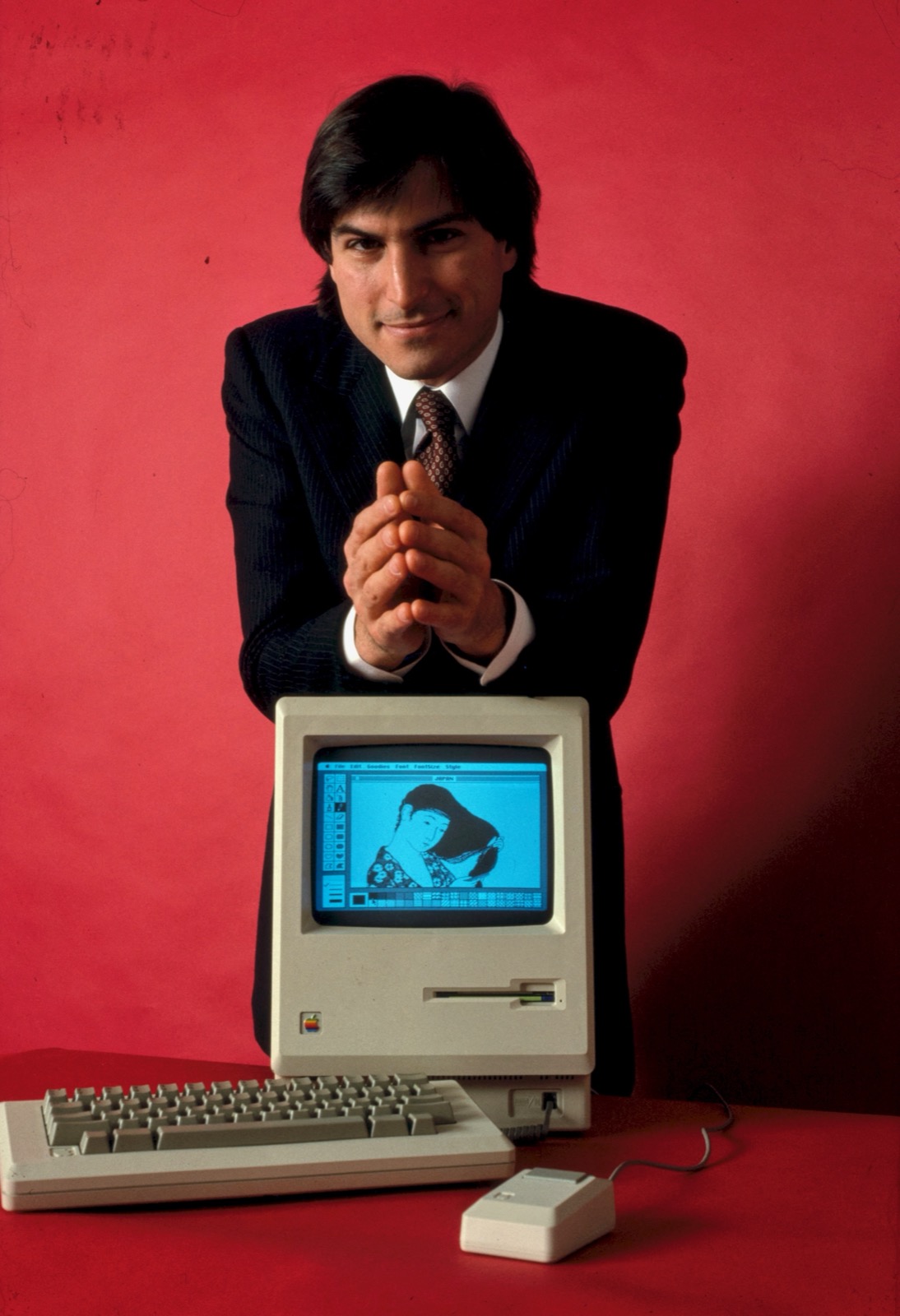 Steve Jobs holding the original Macintosh at Apple's 1984 shareholder meeting